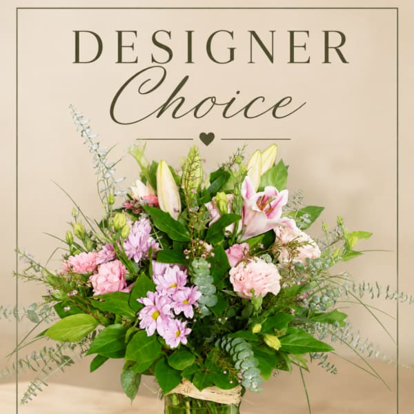 Pink and white mixed flower arrangement in a glass vase