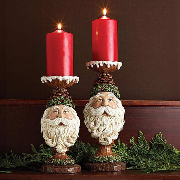 Pair of Santa candle holders with lit red candles