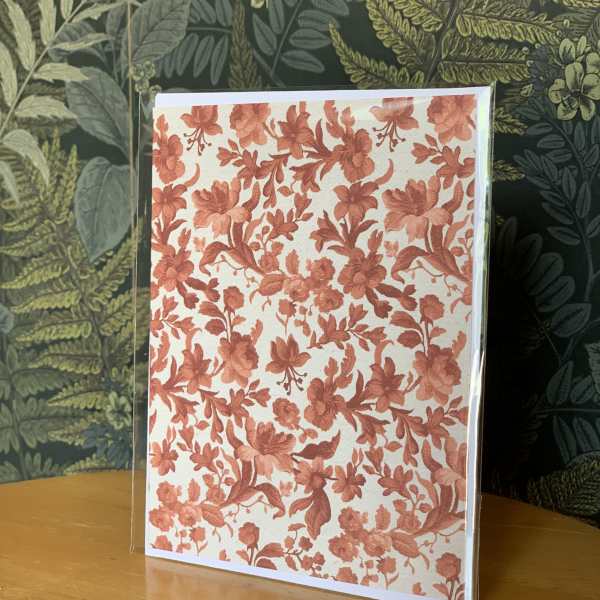 Floral greeting card with coral flower pattern in a clear sleeve