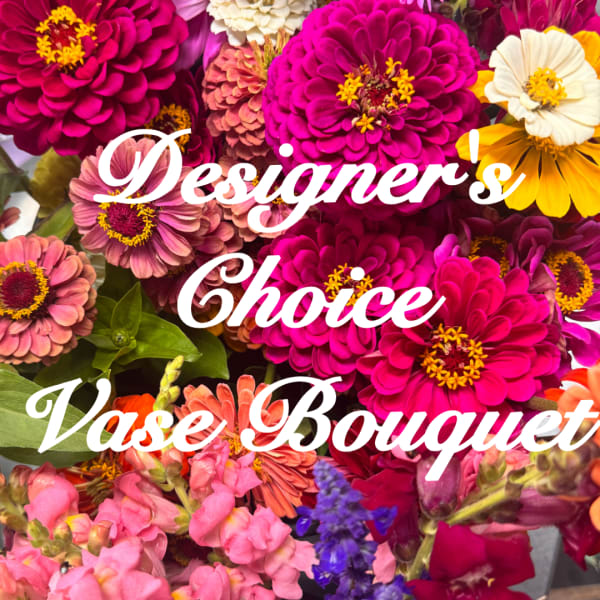 Mixed bouquet of bright zinnias and snapdragons with bold pink and yellow blooms