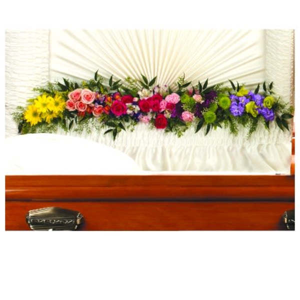 Colorful floral casket spray with roses and daisies