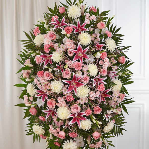 Standing spray of pink and white flowers with lilies and roses