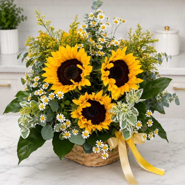 Basket arrangement with sunflowers and small white daisies