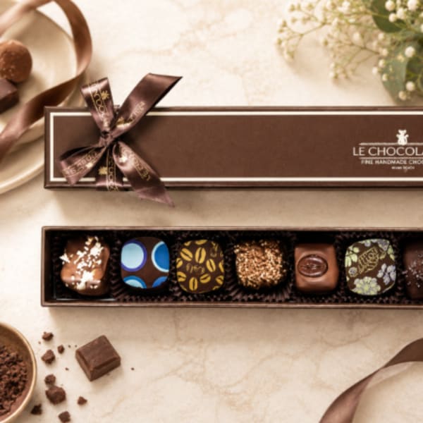 Box of assorted chocolates with a ribbon bow
