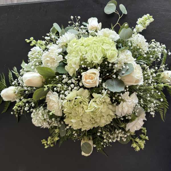 White and pale green floral spray with roses and hydrangeas