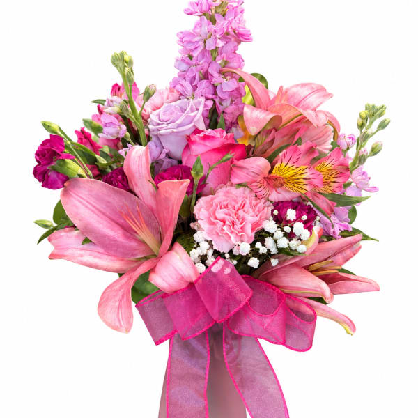 Pink mixed bouquet in a vase with a ribbon bow