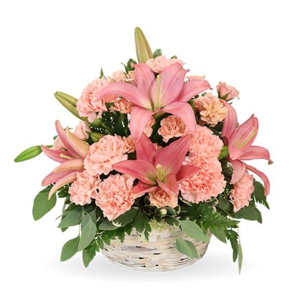 Pink lilies and carnations in a white basket