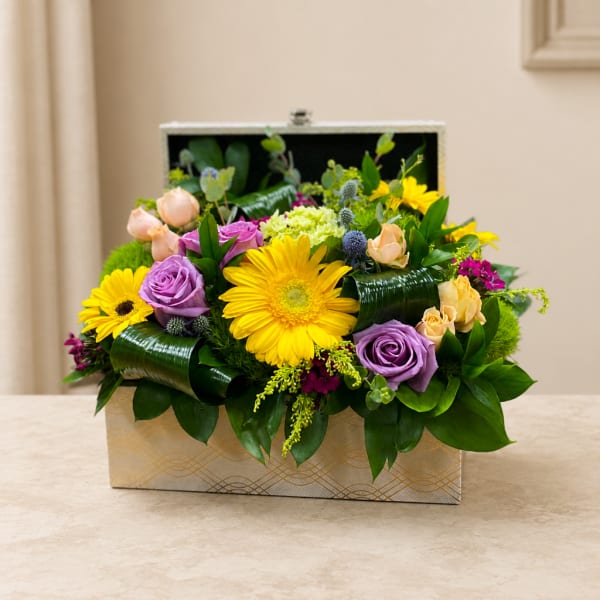 Mixed bouquet in a decorative box with yellow daisies and purple roses