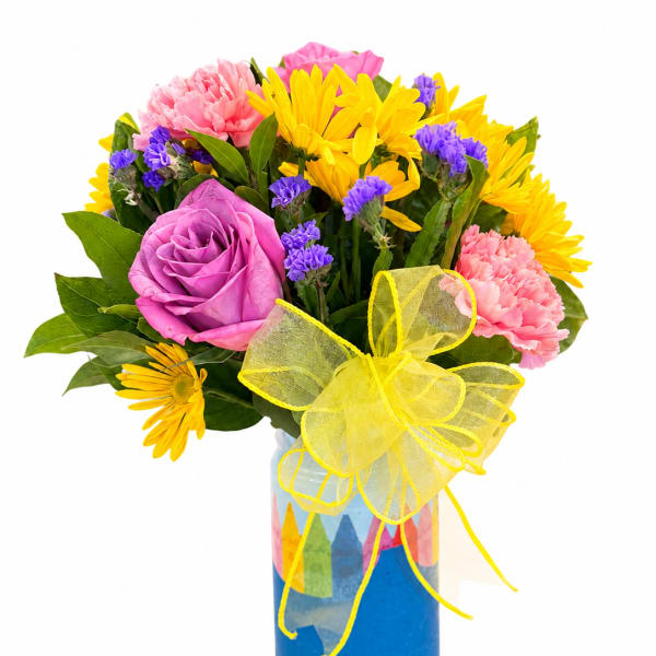 Bouquet of pink and yellow flowers in a blue vase with a yellow bow