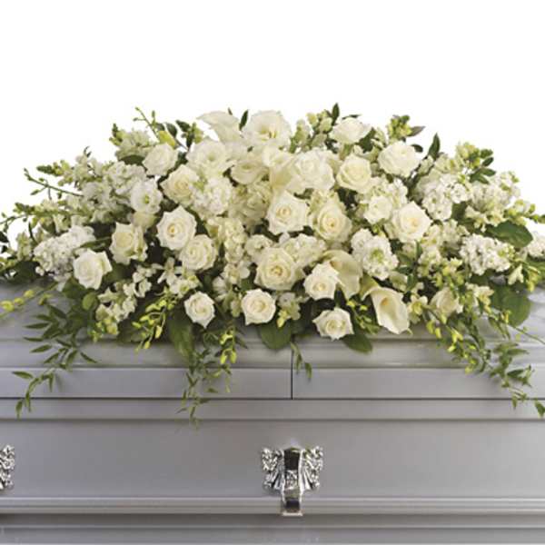 White floral casket spray with roses and calla lilies