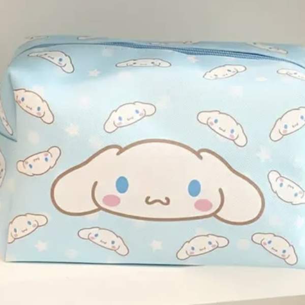 Light blue zippered pouch with a cartoon dog face pattern