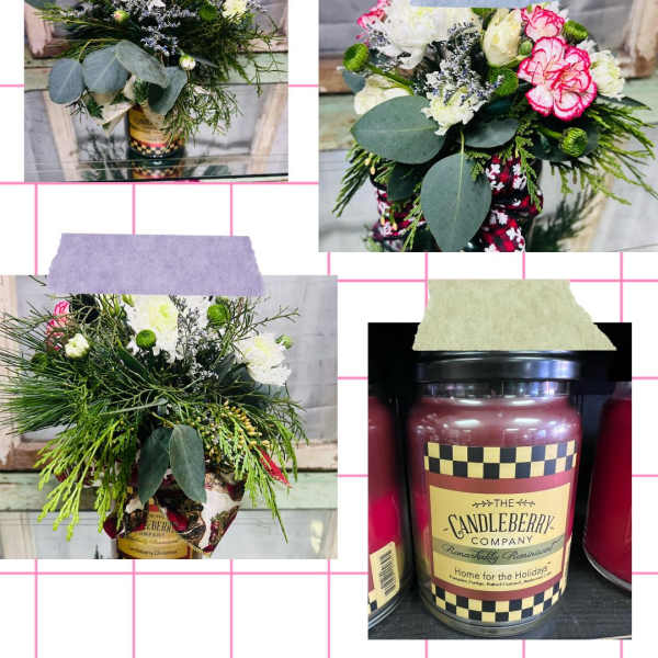 Floral arrangement in a candle jar with white and pink blooms