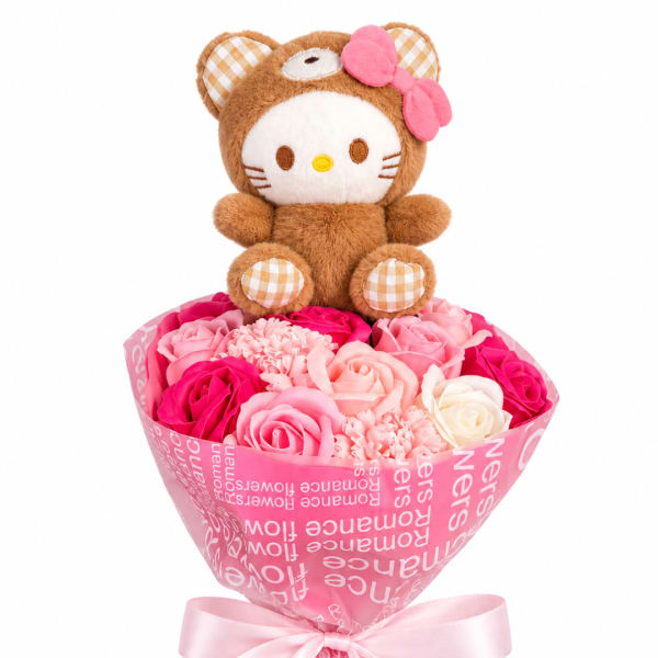 Plush bear sitting on a bouquet of pink and white roses