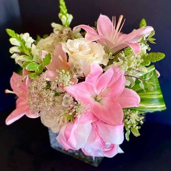 Pink lilies and white roses in a bouquet