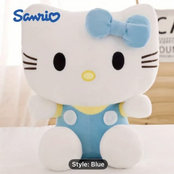 White Hello Kitty plush toy with a blue bow and blue outfit