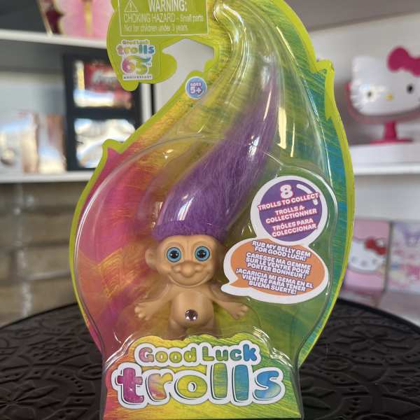 Packaged Good Luck Trolls toy with purple hair