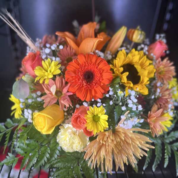 Mixed bouquet with sunflowers, roses, and gerbera daisies
