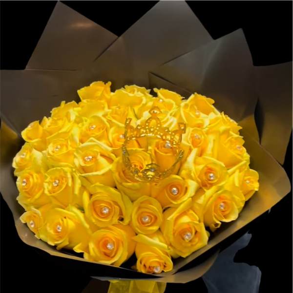 Bouquet of yellow roses with a gold crown decoration