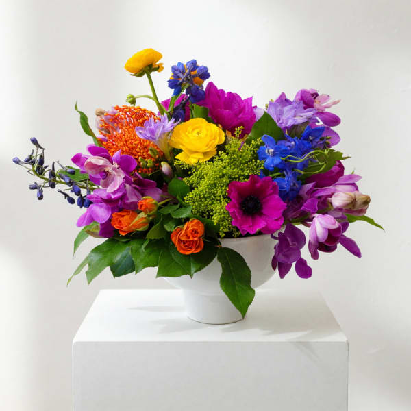 Colorful mixed bouquet in a white vase