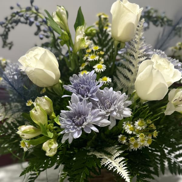 White roses and lavender chrysanthemums in a mixed bouquet