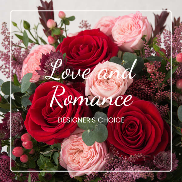 Bouquet of red and blush roses with purple filler flowers