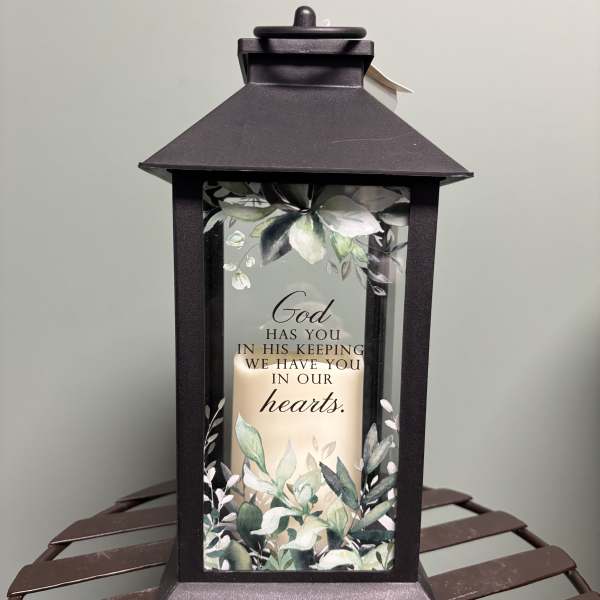 Black memorial lantern with a candle and floral print