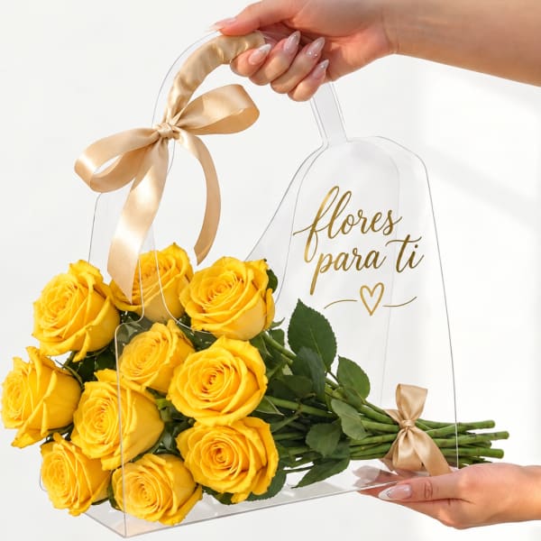 Yellow roses in a clear gift box with a satin ribbon