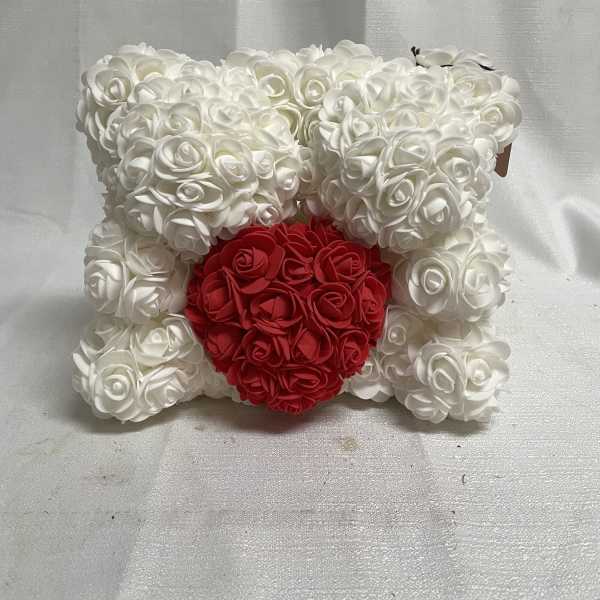 White rose teddy bear with a red heart on the front