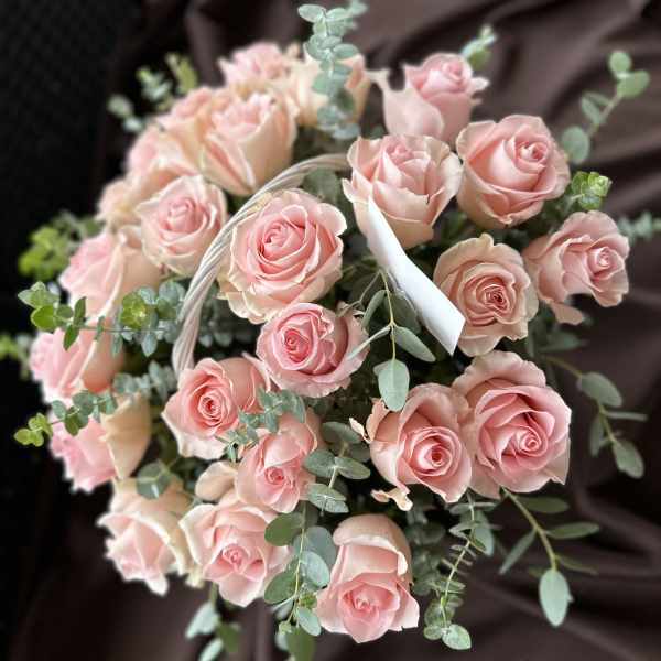 Bouquet of pale pink roses with eucalyptus accents
