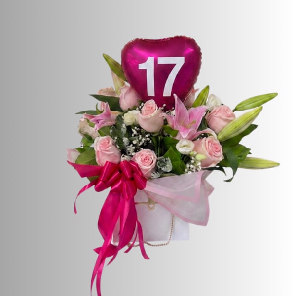 Pink rose bouquet with lilies and a heart-shaped "17" balloon