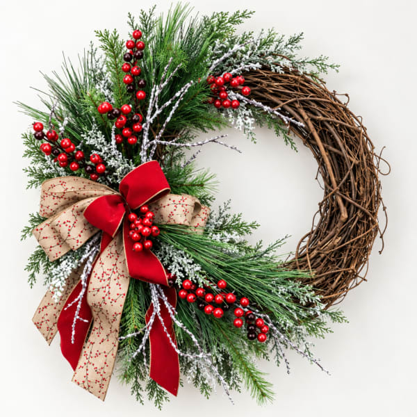 Holiday wreath with pine, red berries, and a red-and-tan bow