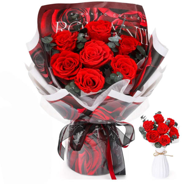 Bouquet of red roses wrapped in black and white paper with a ribbon
