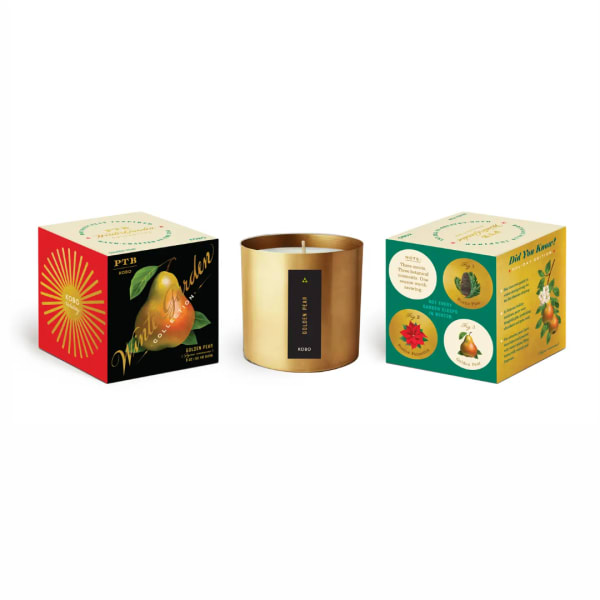 Three boxed candles, including a gold tin candle in the center