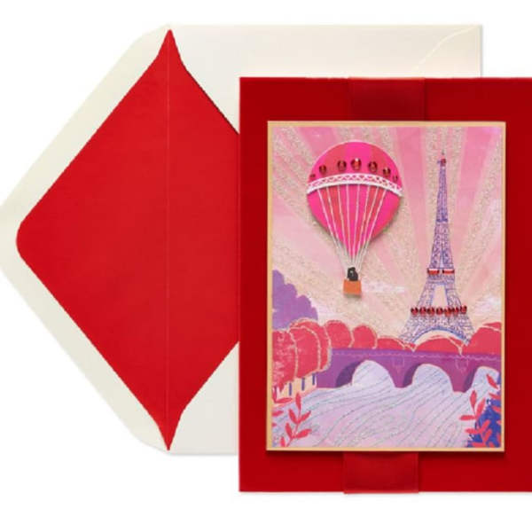 Red envelope-style card with a Paris-themed illustration