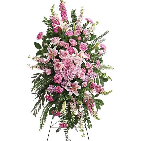 Tall pink floral standing spray on an easel