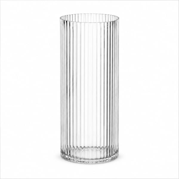 Tall clear ribbed glass vase on a white background