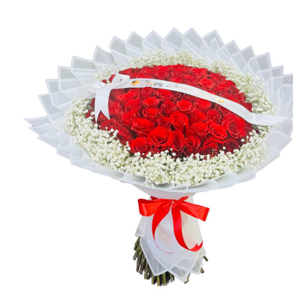 Bouquet of red roses with white baby's breath and a red ribbon