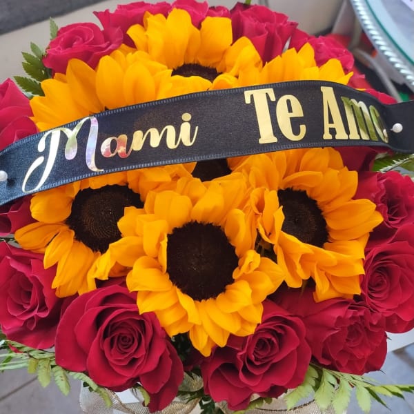 Bouquet of red roses and yellow sunflowers with a black ribbon banner