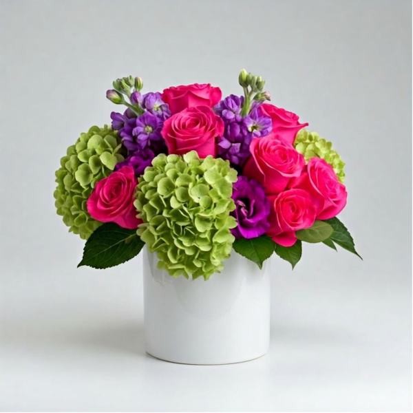 Pink roses and green hydrangeas in a white vase