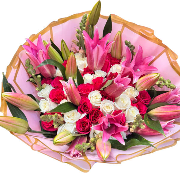 Bouquet of pink lilies and red and white roses wrapped in pink paper