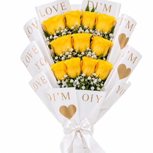 Bouquet of yellow roses wrapped in white paper with gold lettering
