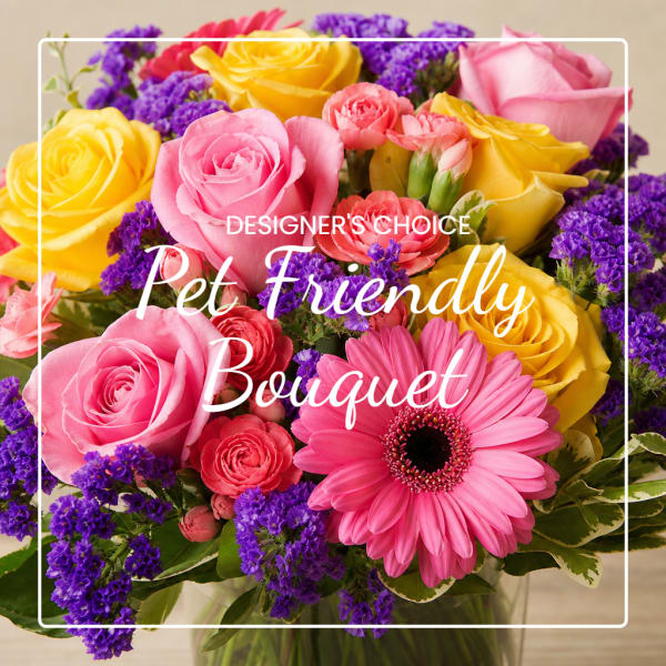 Pink and yellow rose bouquet with a pink gerbera daisy and purple filler flowers