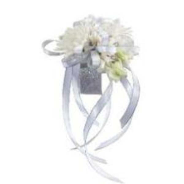 White floral wrist corsage with silver ribbon streamers