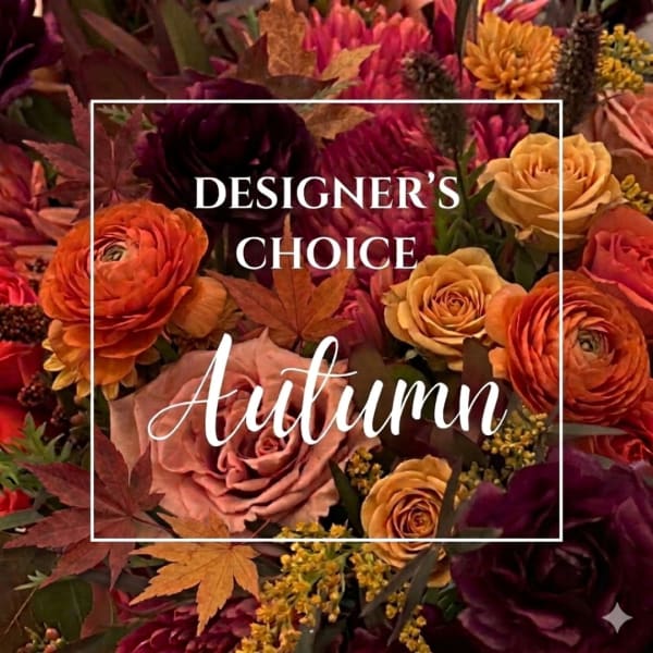 Autumn floral arrangement with orange, gold, and burgundy blooms