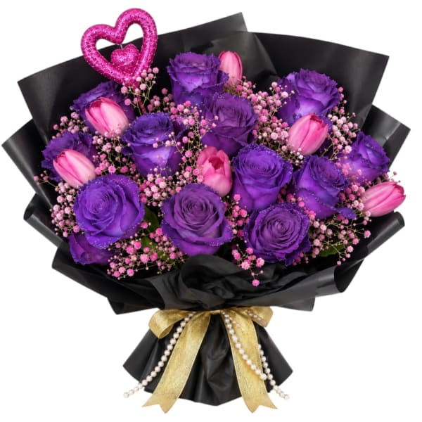 Purple roses and pink tulips in black wrap with a gold ribbon and heart pick