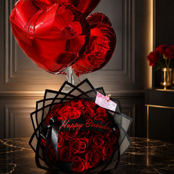 Red rose bouquet with heart-shaped balloons and a Happy Birthday sign
