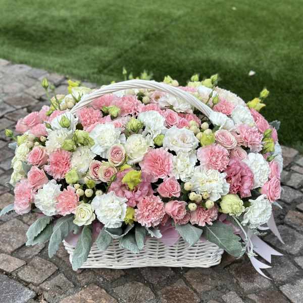 Pink and white flower basket with a white handle