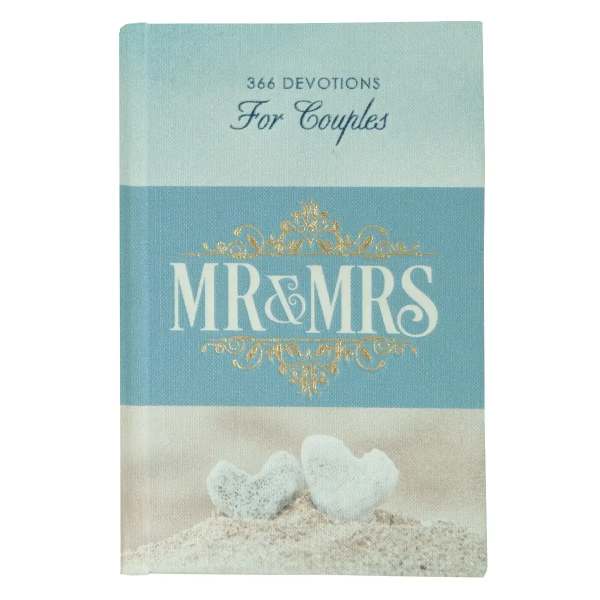 A blue book titled "MR & MRS" with two white heart stones on the cover
