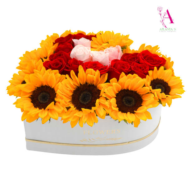 Heart-shaped box arrangement of sunflowers and red and pink roses