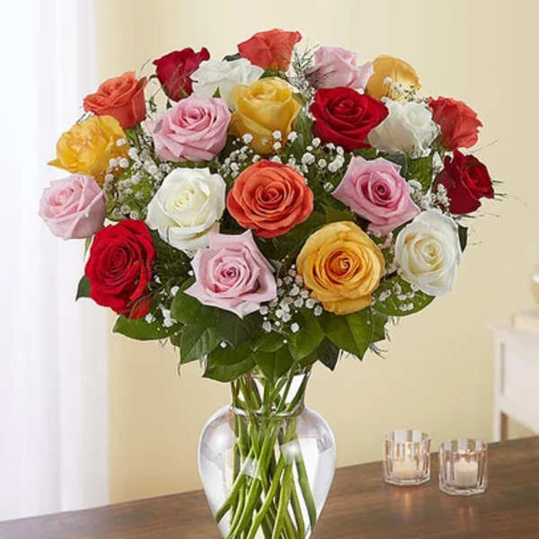Mixed roses in a clear glass vase